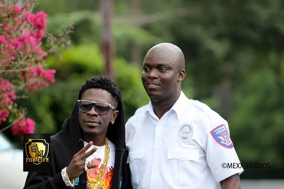 shatta Wale with the dude who will be serving their lunch........lol.........can't i joke?