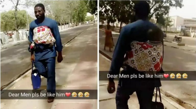 Nigerian lecturer carrying a baby