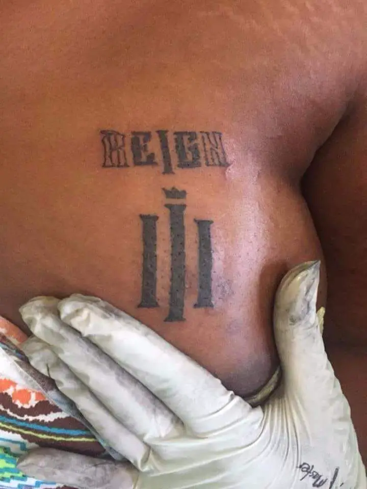 girl tattos shatta wale reign album on her breast