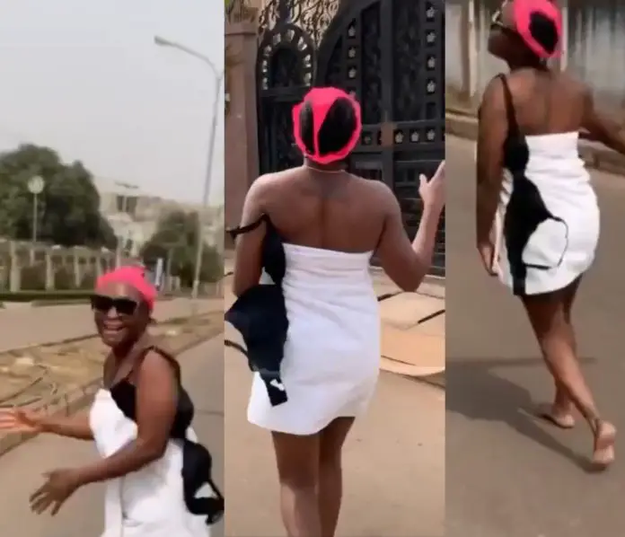 Nollywood bloger Blessing Okoro goes on the street in just her towel with panties on her head to celebrate 500K followers on Instagram [video]